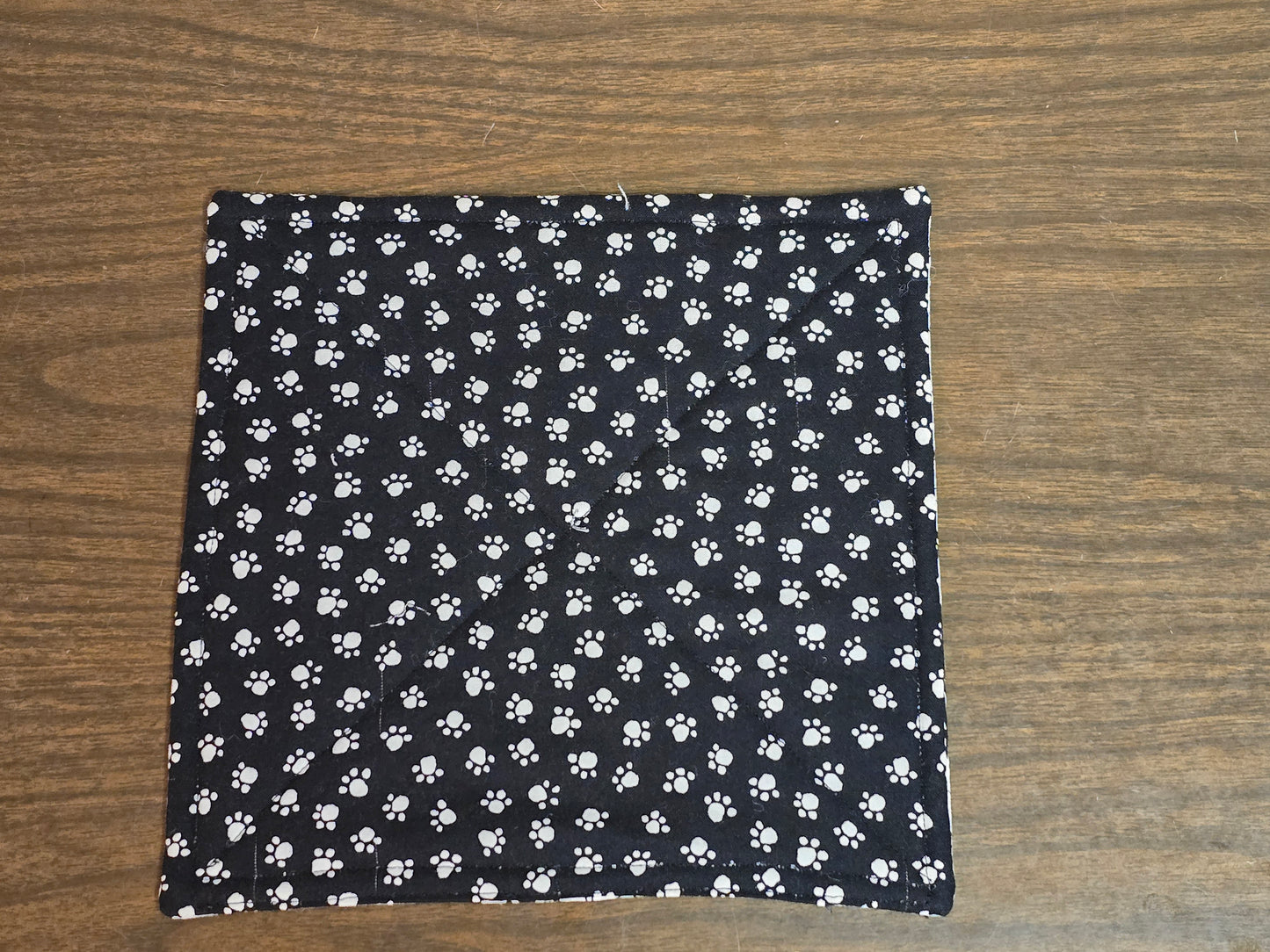 Pot-Holder-black and white dogs with white paw print