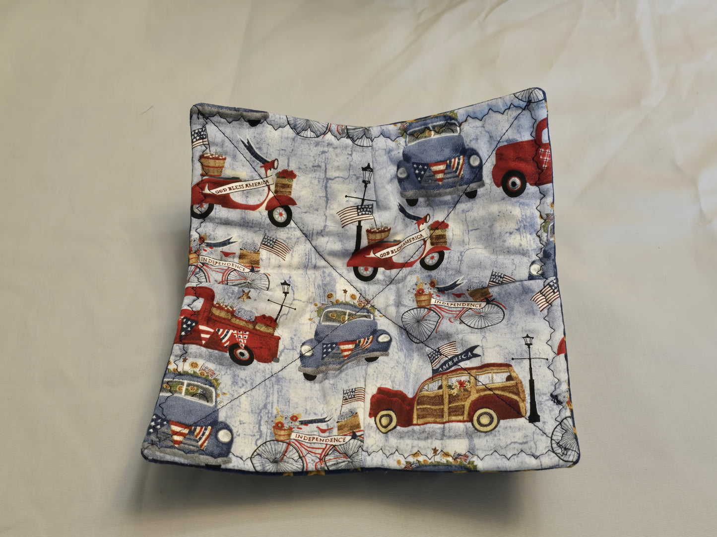 Plate cozy-trucks on pale blue with stars on dark blue