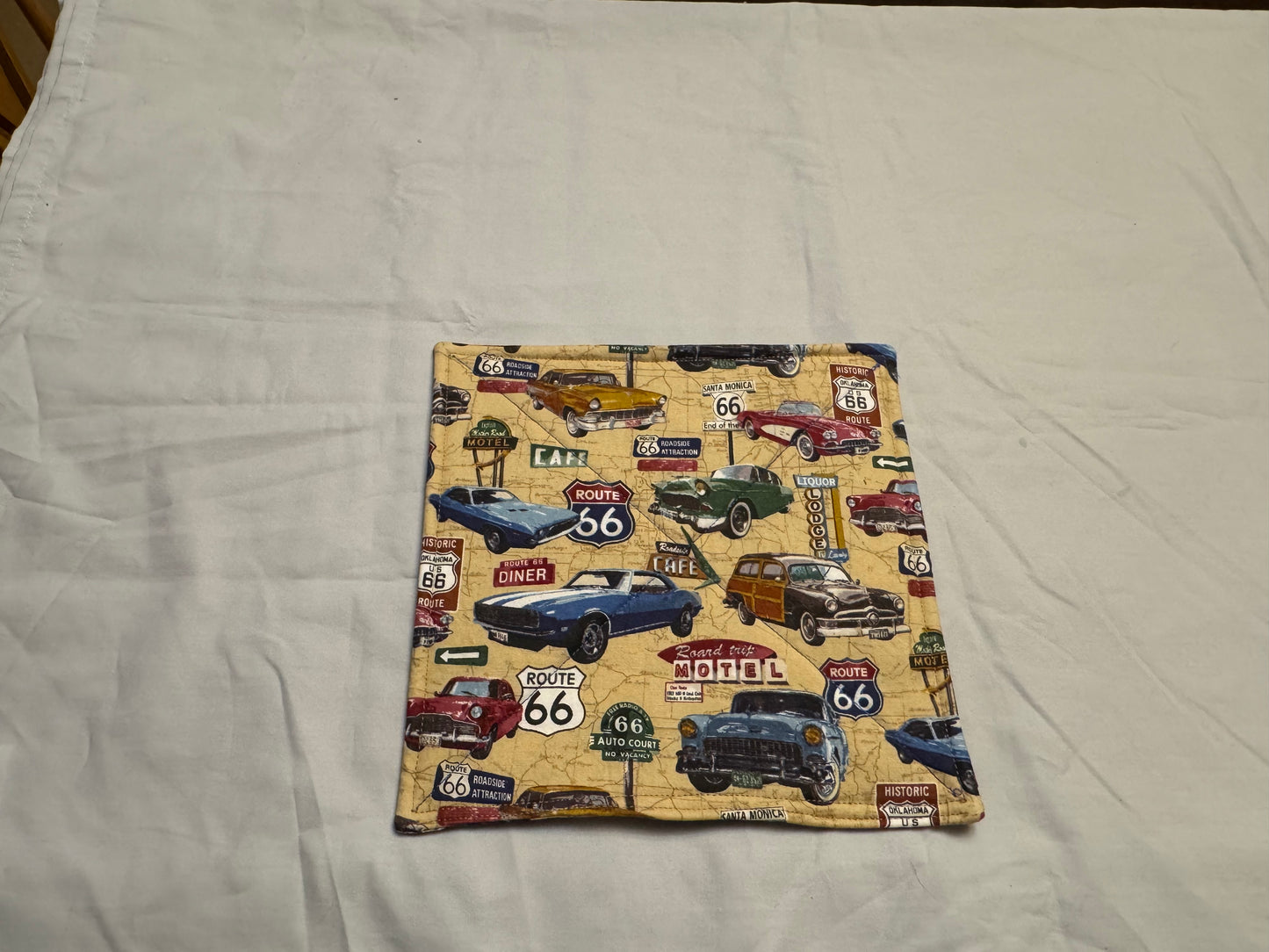 Pot holder classic cars on road map