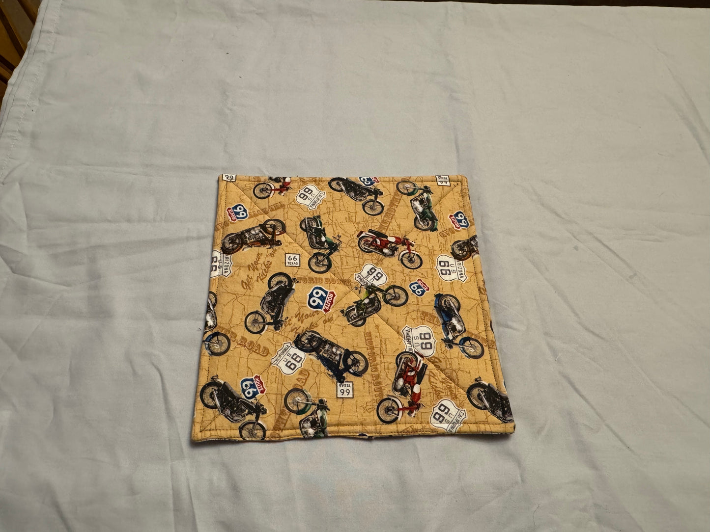 Pot holder motorcycles on road map