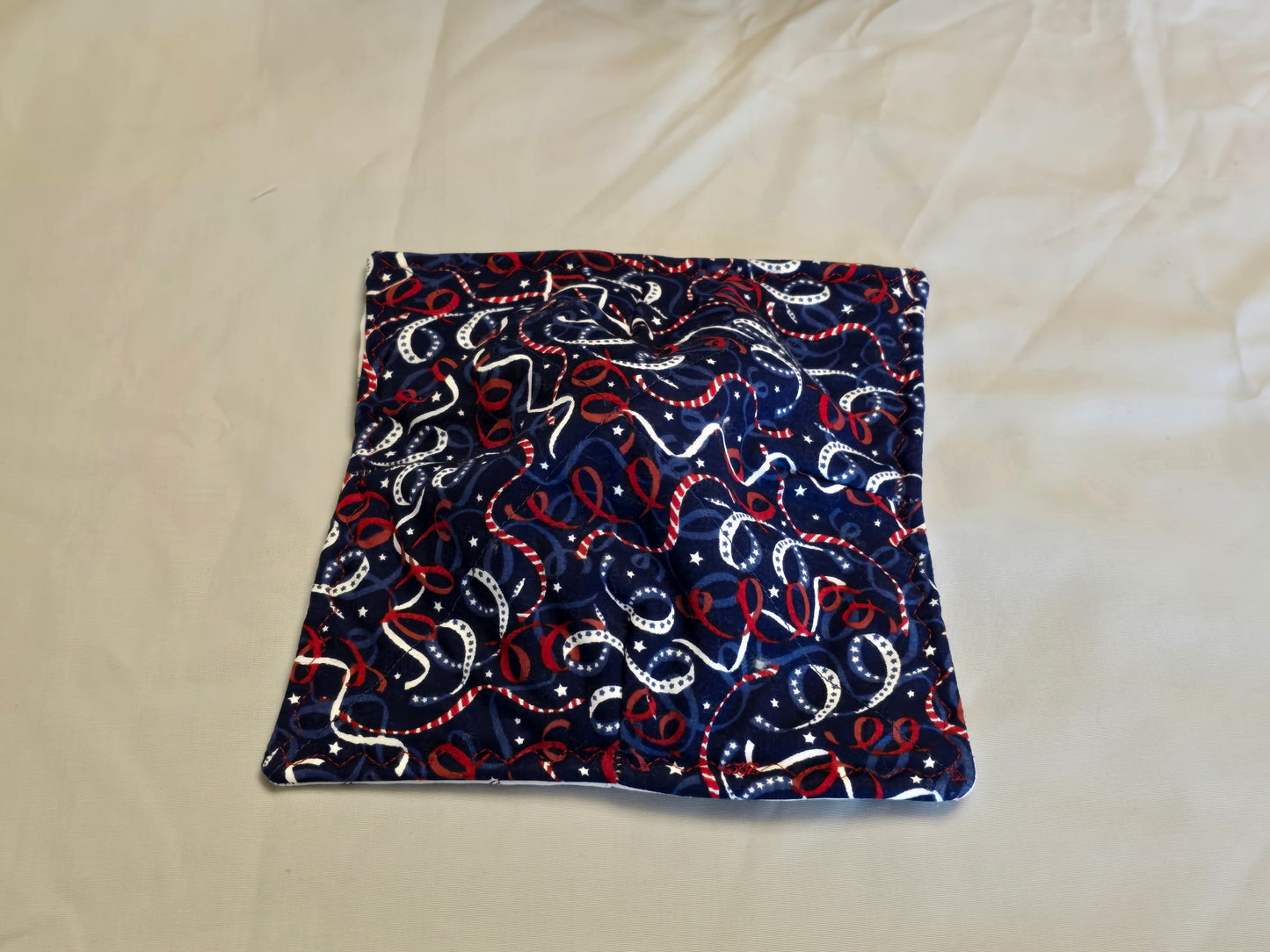 Plate Cozy-red white and blue spirals with flag wind mill